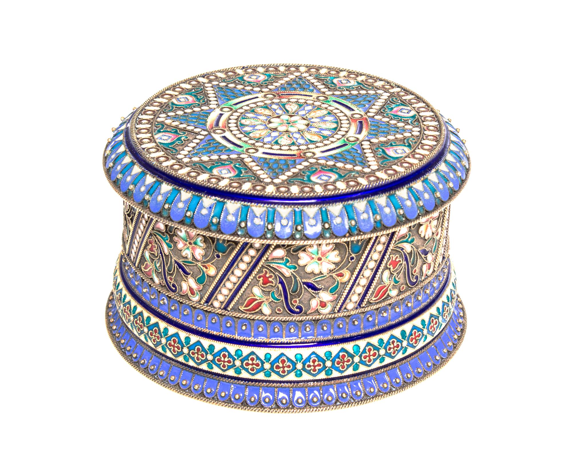 A Russian Enameled Gilt-Silver Box, Khlebnikov, St. Petersburg, 1908-1926, of cylindrical form with hinged lid and with polychrome flor