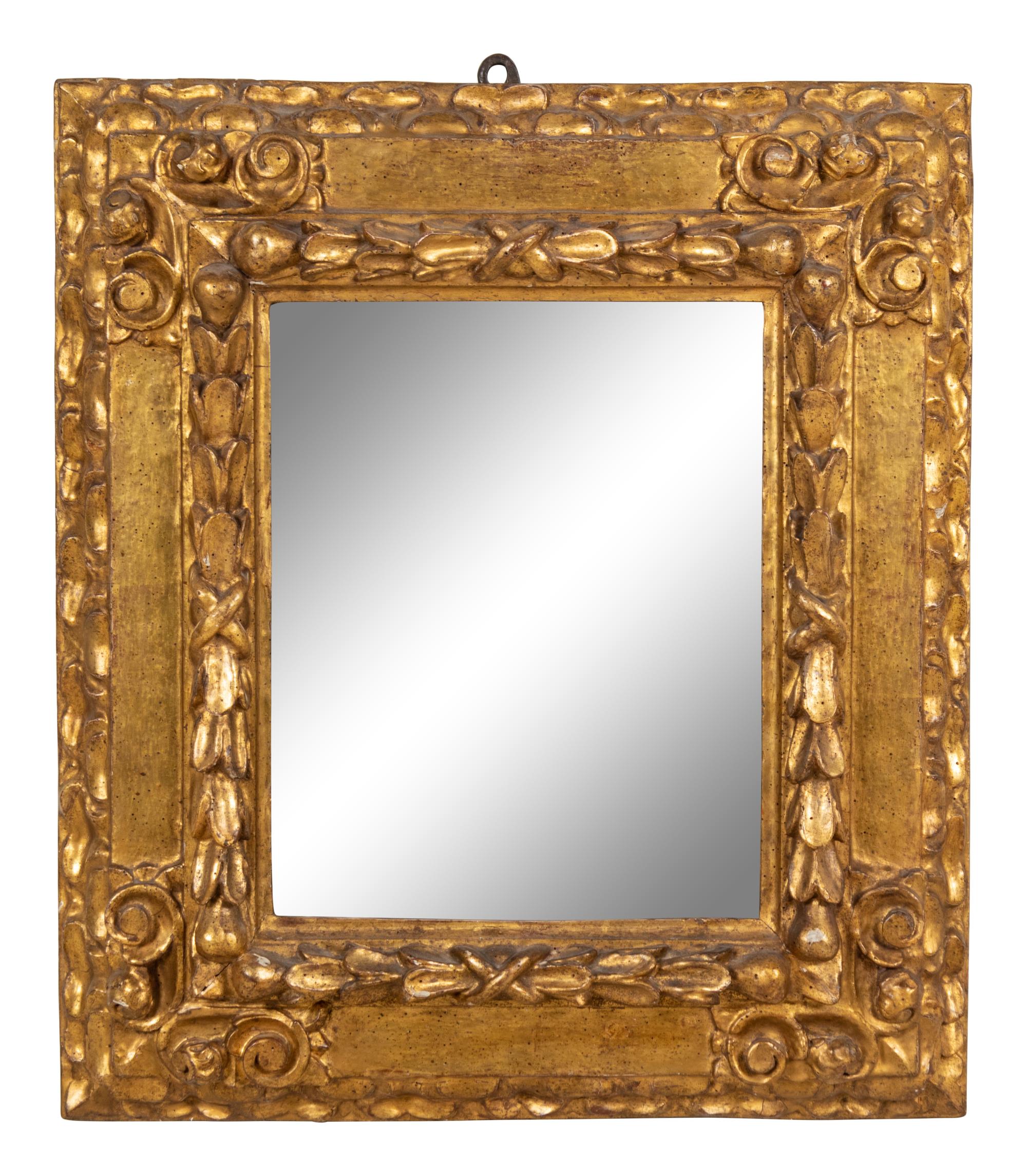 A Continental Carved Giltwood Mirror