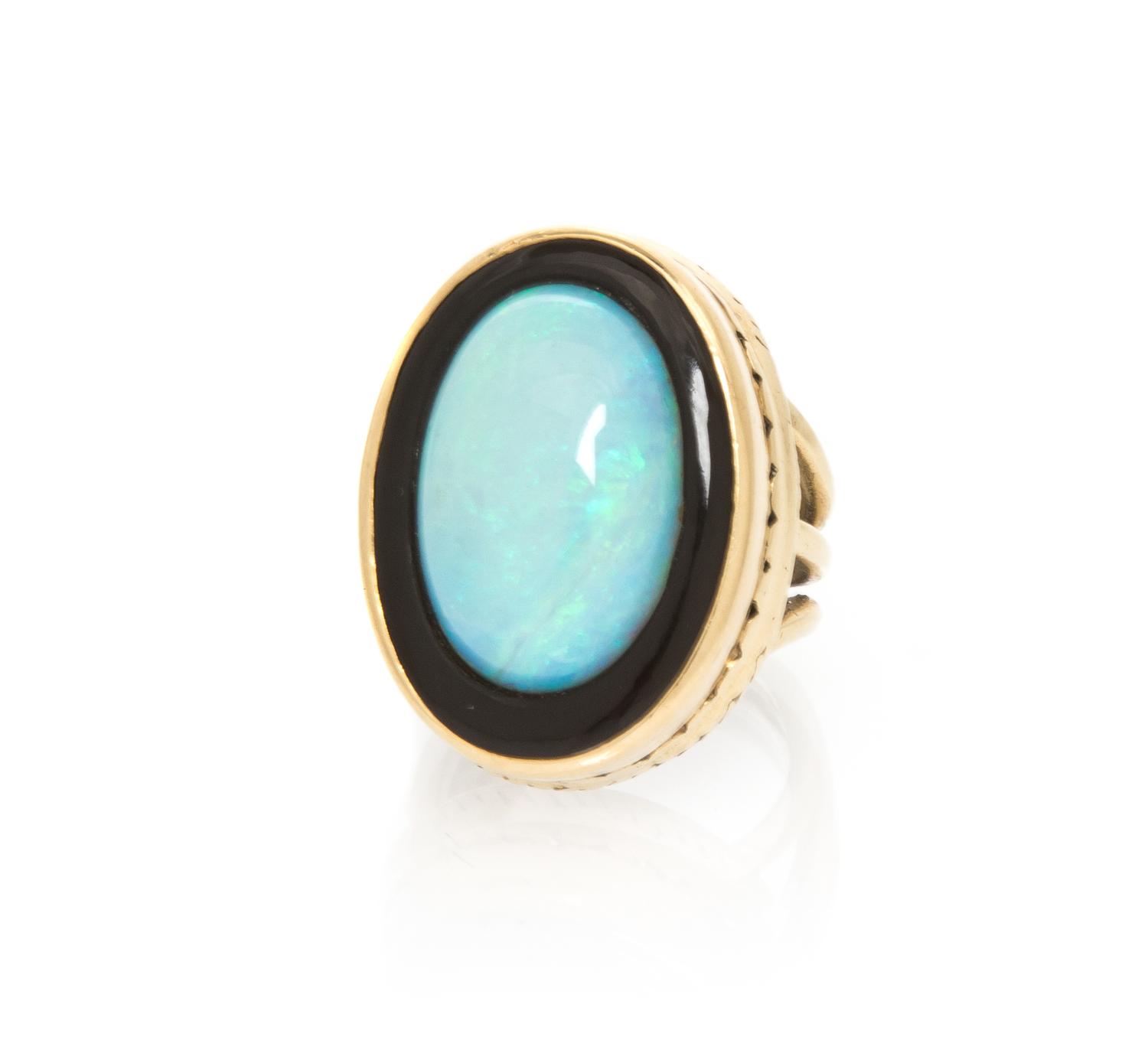 A Yellow Gold, Opal and Onyx Ring, 10.90 dwts.