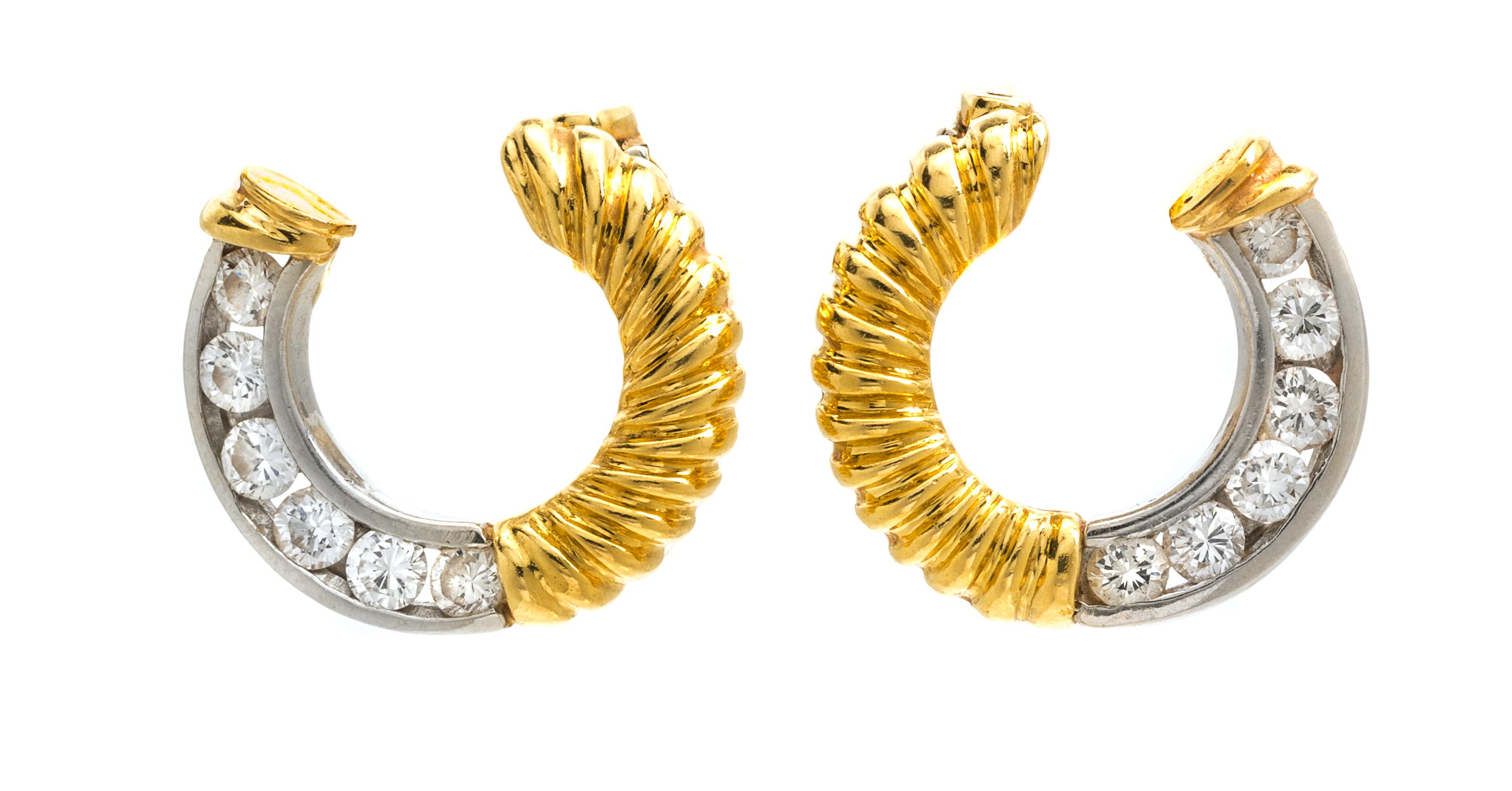 A Pair of 18 Karat Gold and Diamond Earclips, 5.90 dwts.