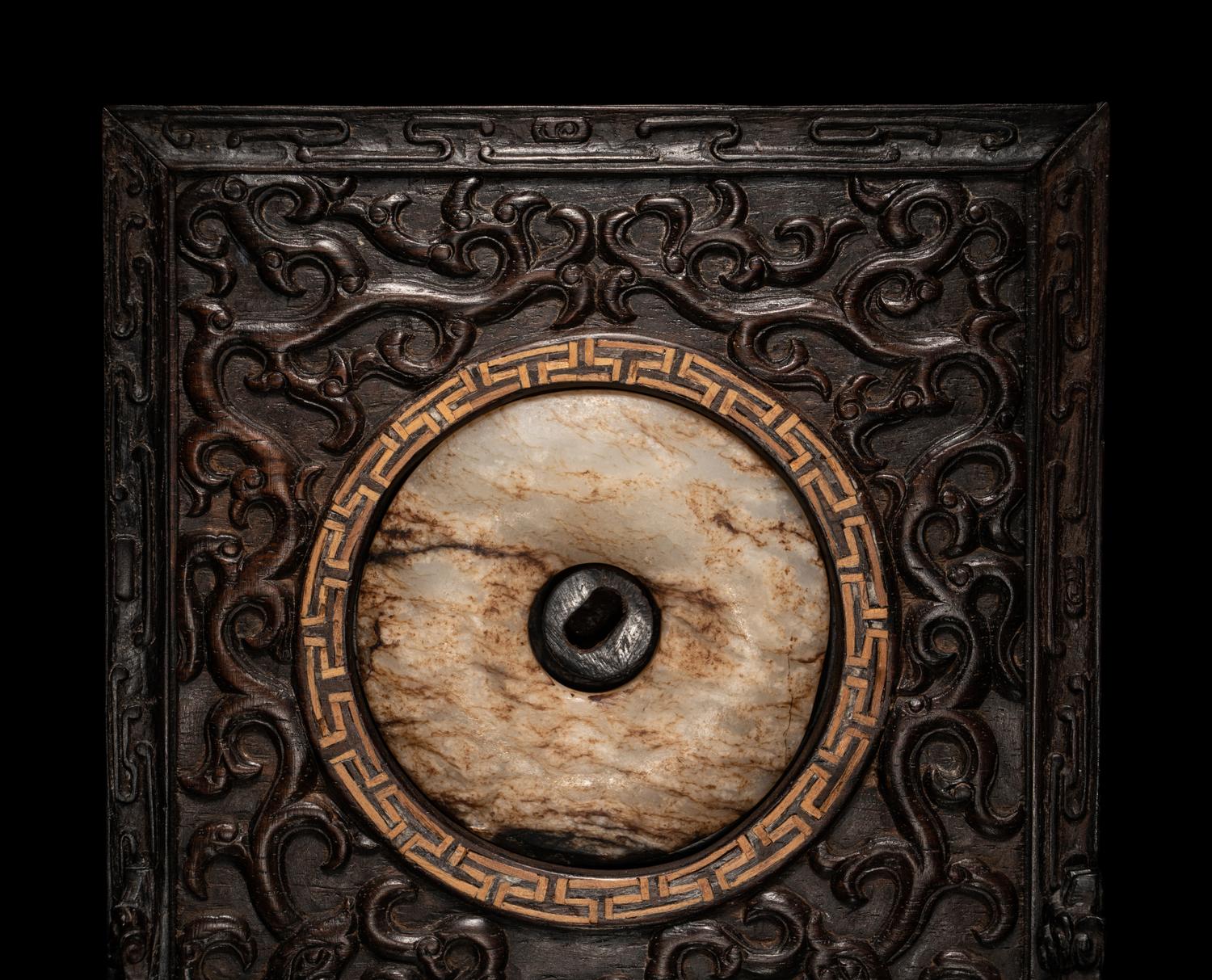 A Chinese Jade Bi Disc Inset Hardwood Table Screen