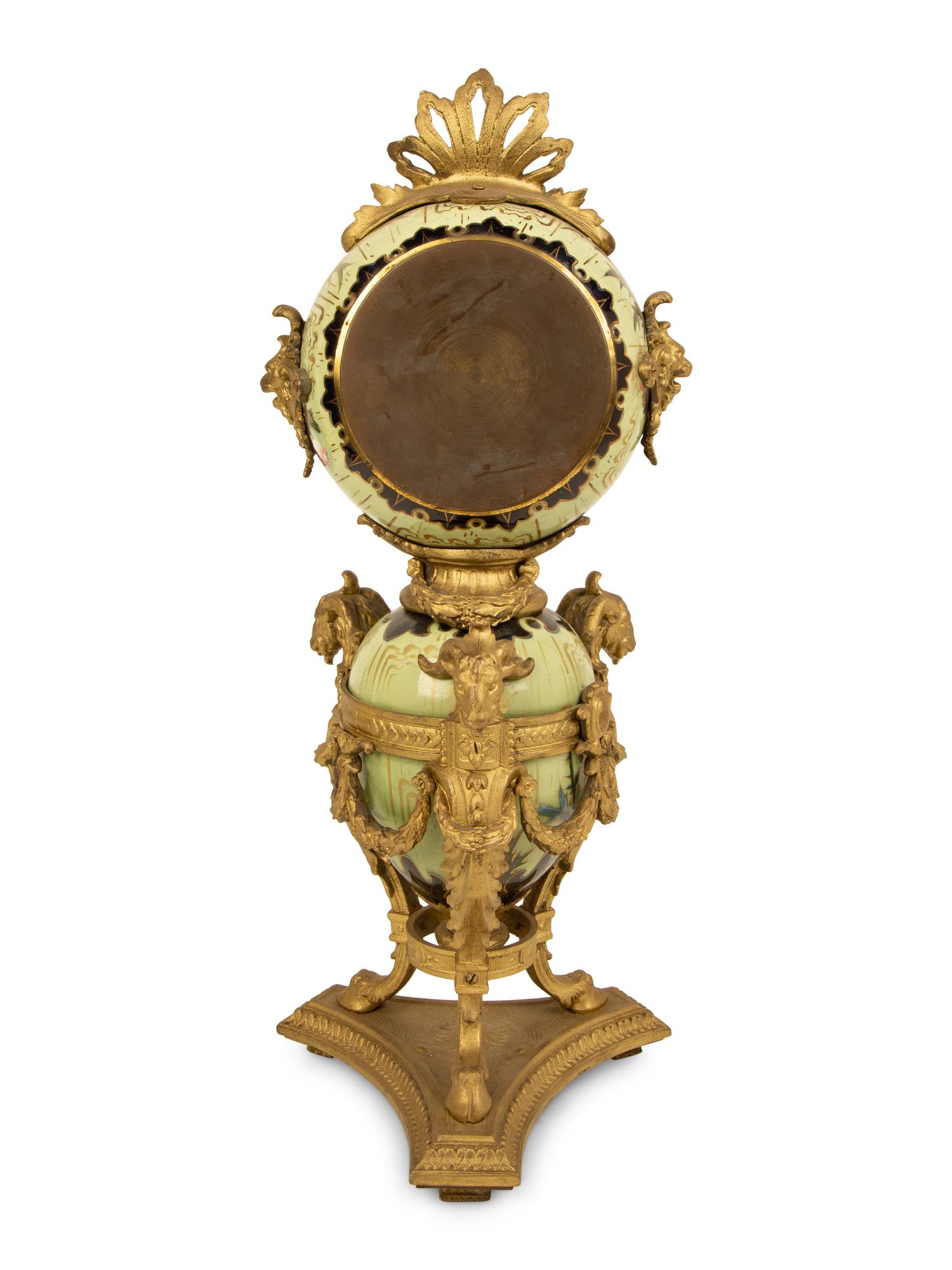 A French Gilt Bronze and Glazed Pottery Clock — LATE 19TH CENTURY