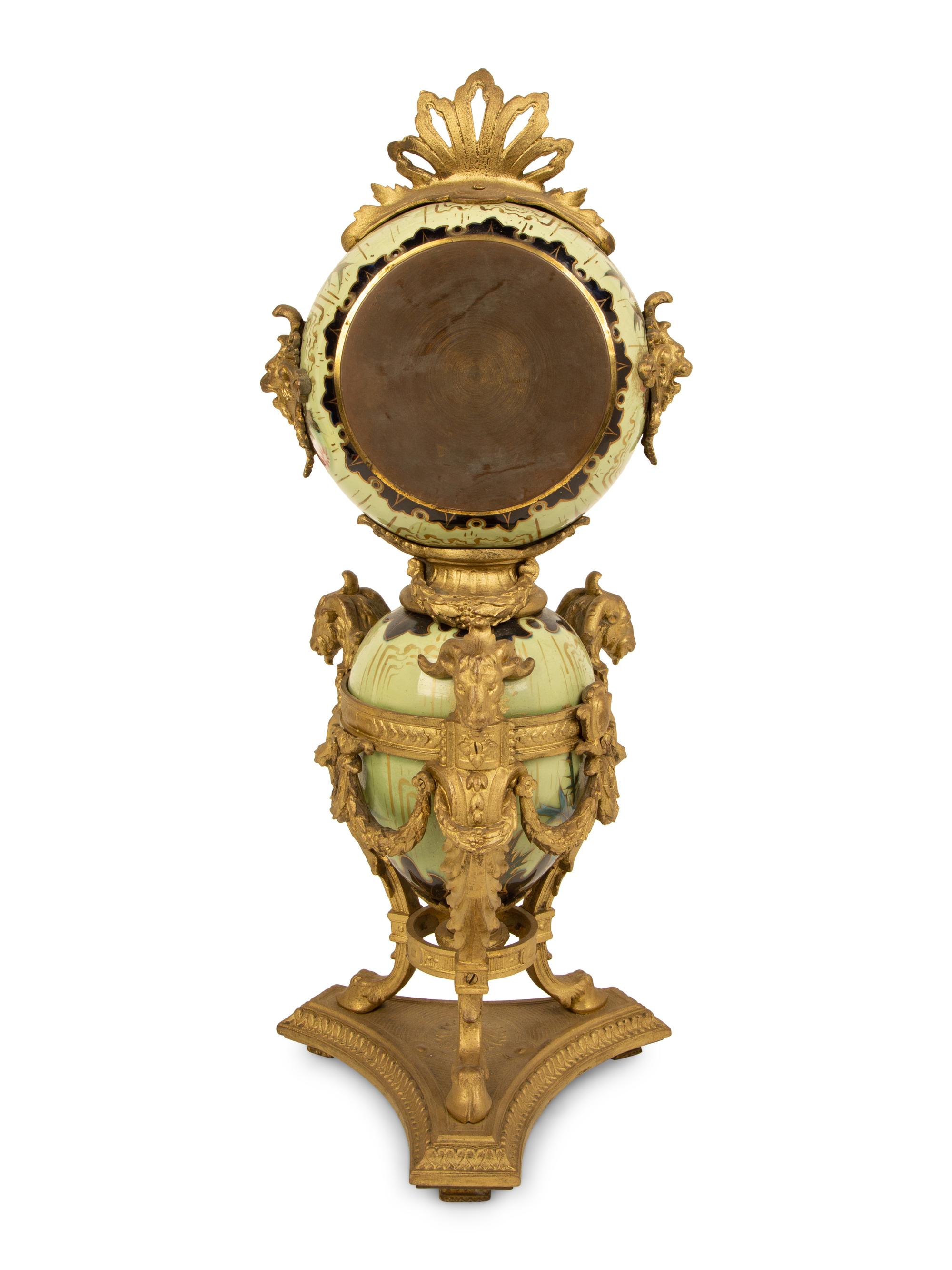 A French Gilt Bronze and Glazed Pottery Clock — LATE 19TH CENTURY