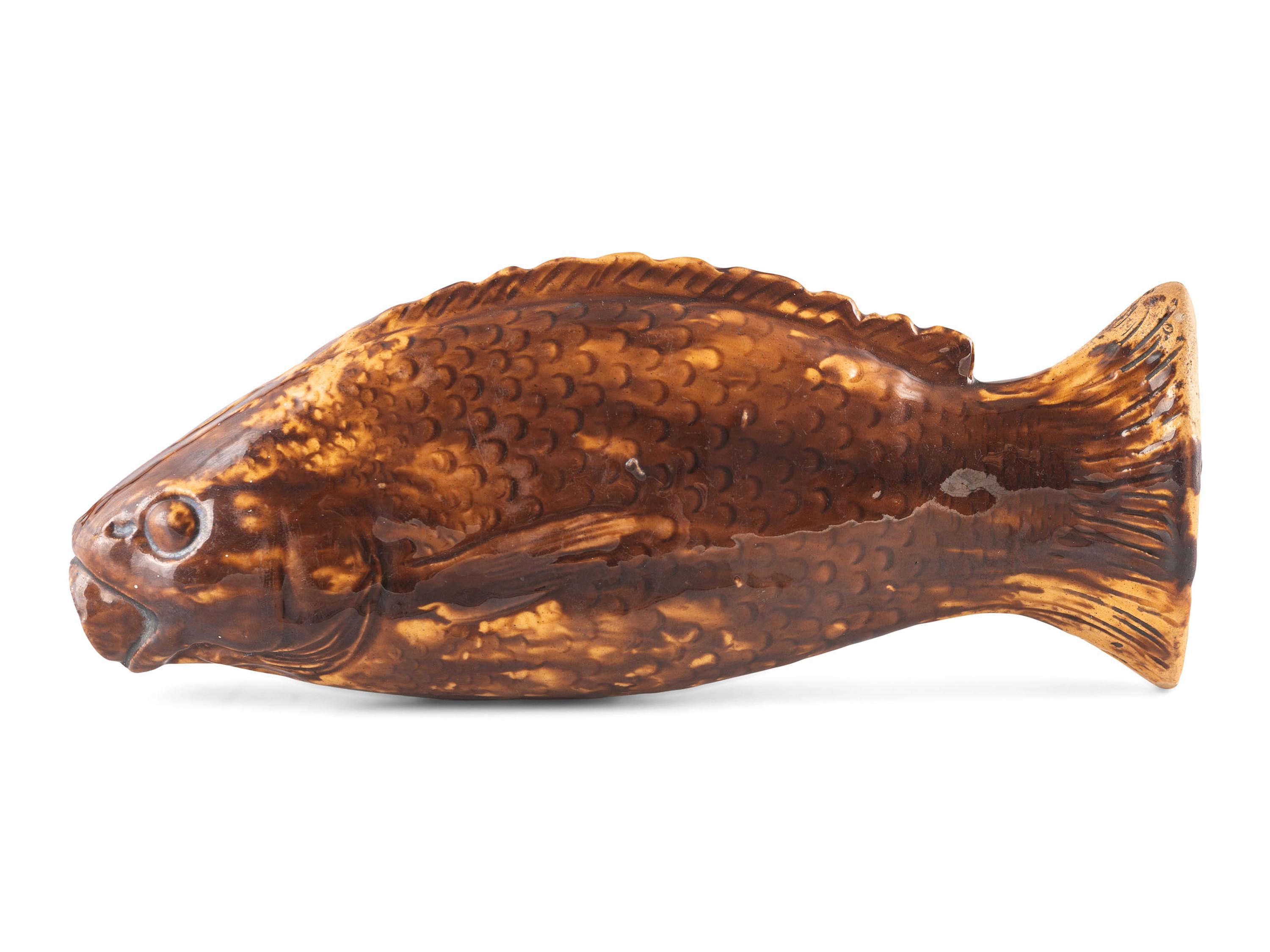 A Yellowware Rockingham Glaze Fish Flask