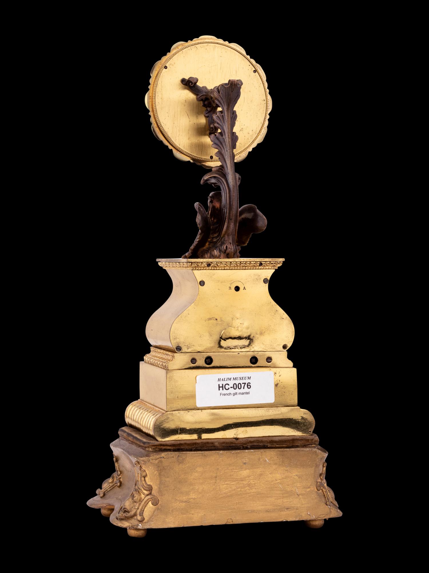 A French Gilt and Patinated Bronze Mystery Clock, with Wood Base, Attributed to Jean Eugene Robert Houdin