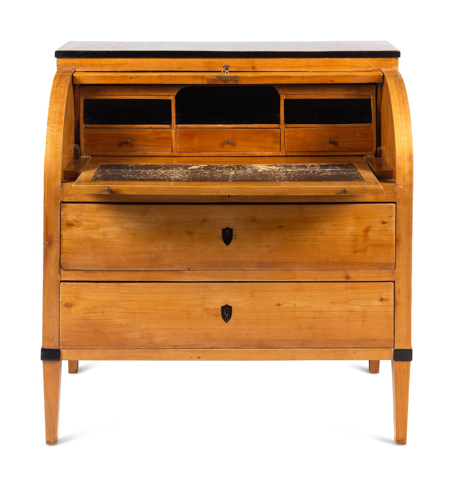 A Biedermeier Part-Ebonized Birch Cylinder Bureau