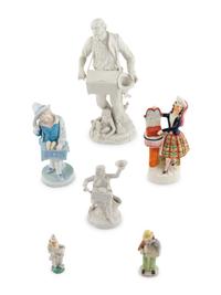 A Group of Fourteen Street Organist Figurines