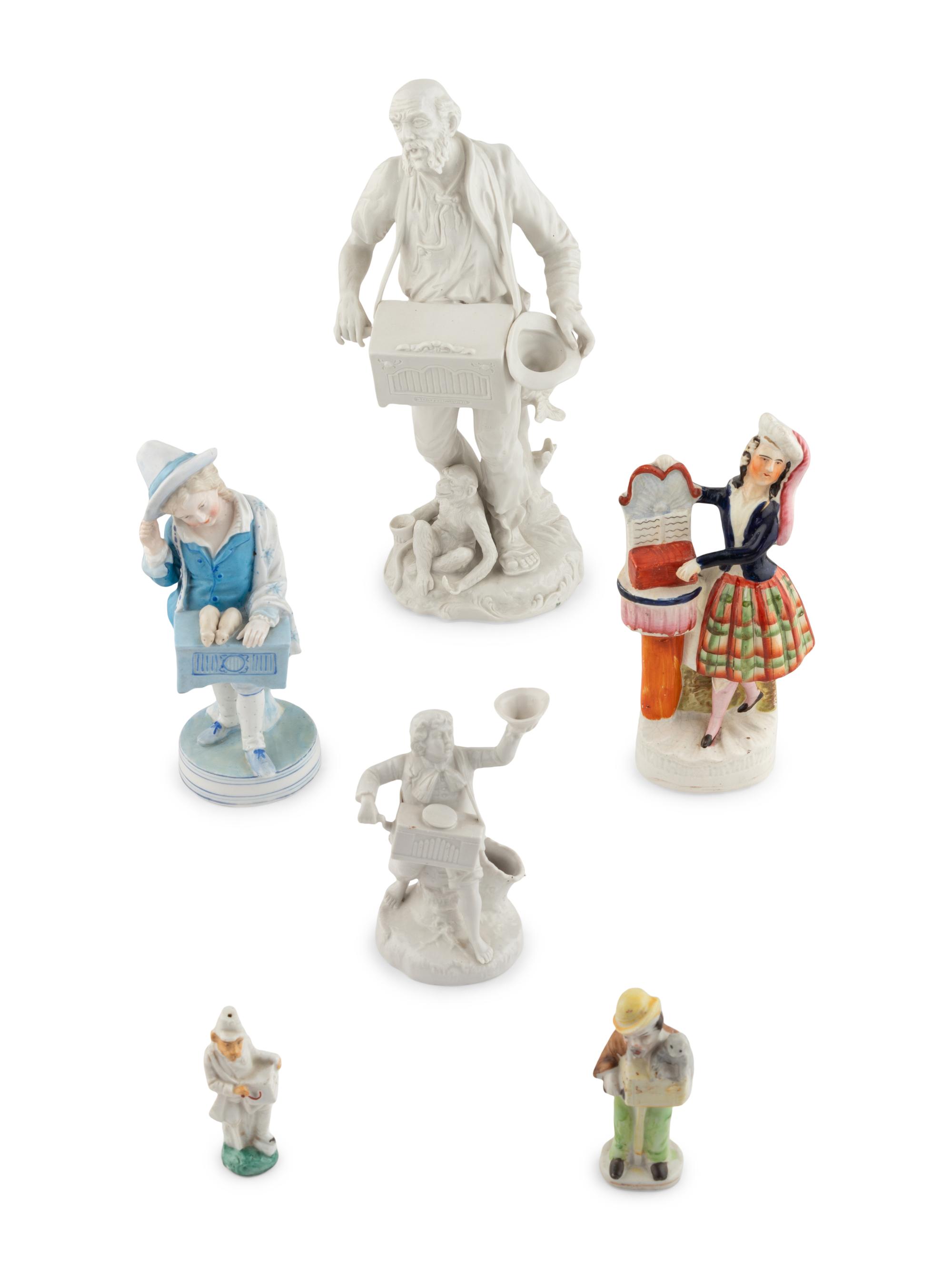 A Group of Fourteen Street Organist Figurines