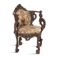 An Italian Carved Walnut Corner Chair