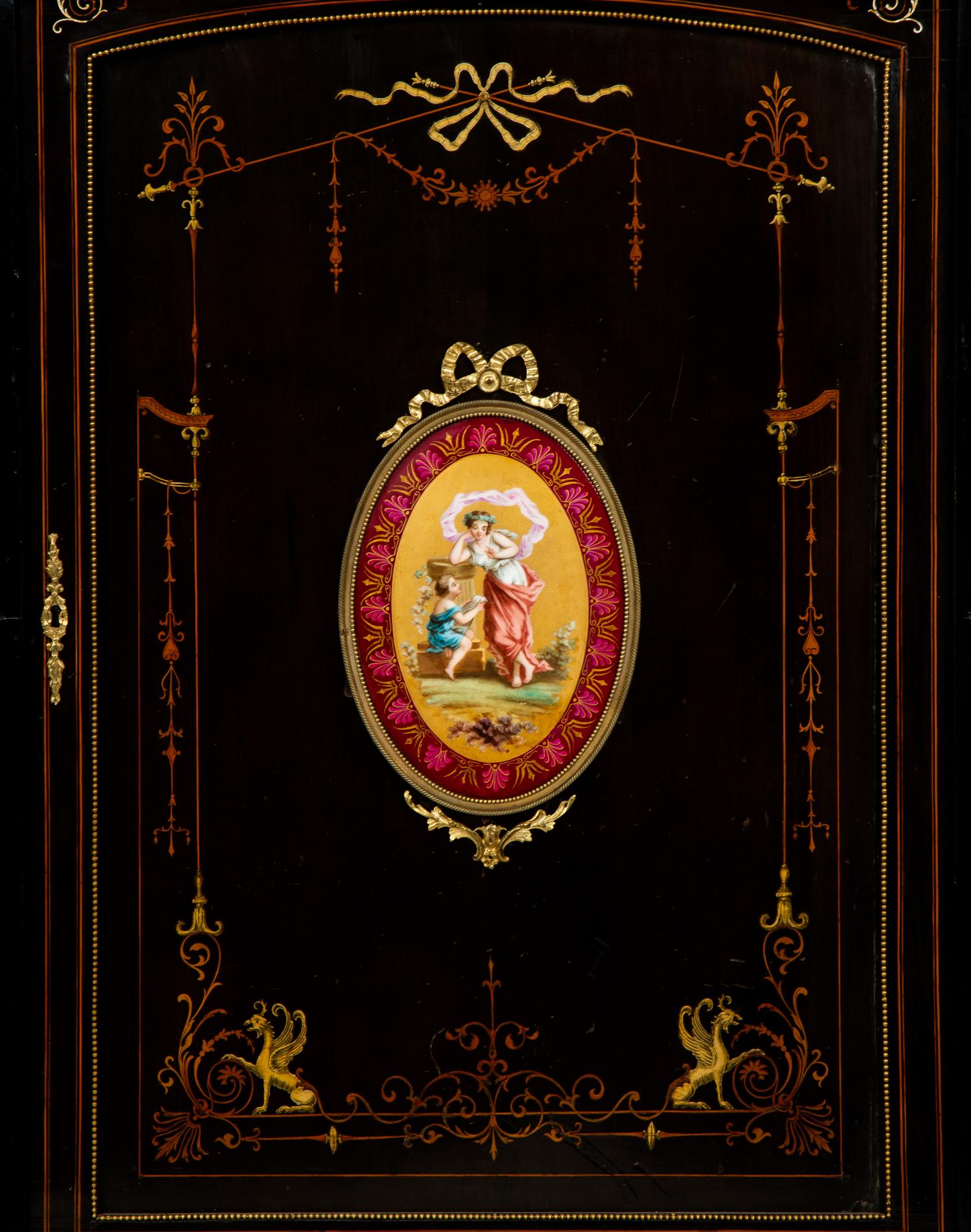 A Napoleon III Gilt Bronze and Porcelain Mounted Ebony and Marquetry Cabinet — CIRCA 1870