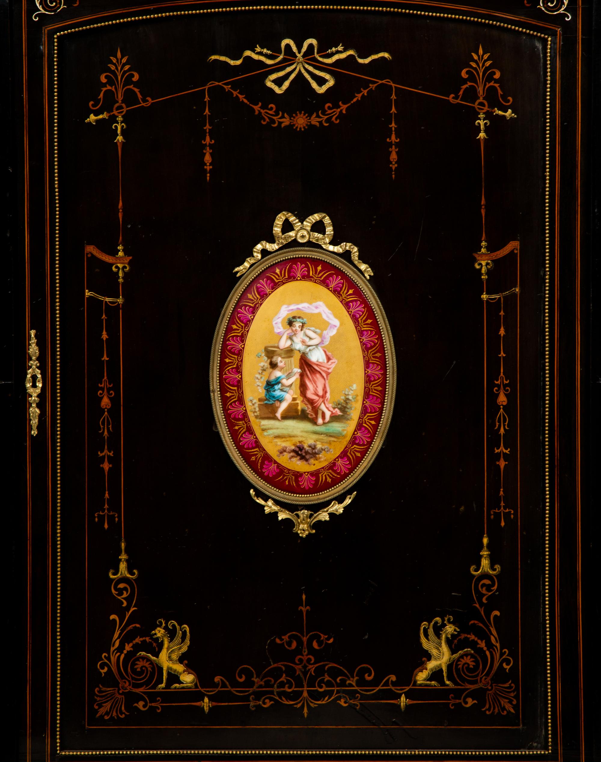 A Napoleon III Gilt Bronze and Porcelain Mounted Ebony and Marquetry Cabinet — CIRCA 1870