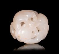 A White Jade Carving of Squirrel and Peaches
