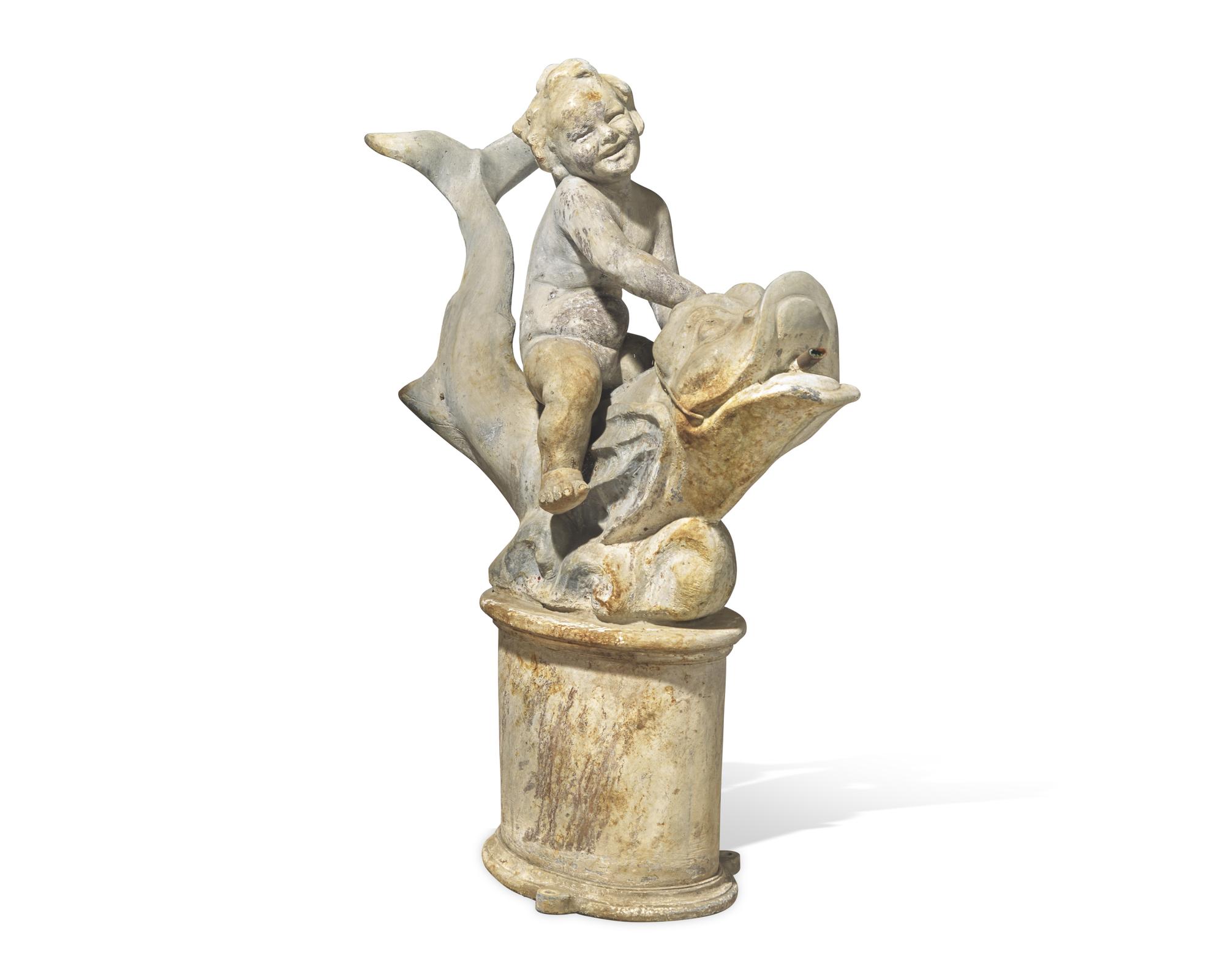 A lead or zinc fountain head in the form of a putto riding a dolphin, 19th / 20th century