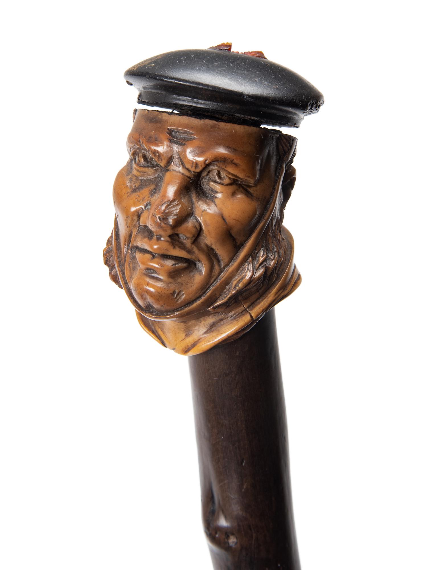 Two Figural Carved Canes