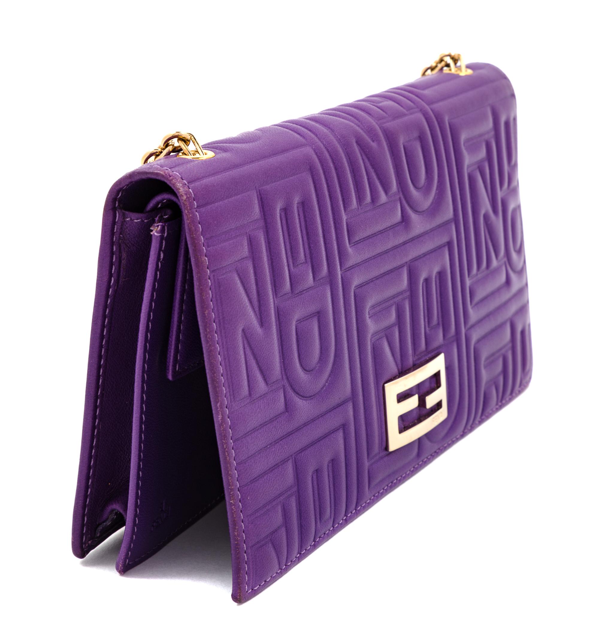 A Fendi Purple Monogram Embossed Leather Wallet/Shoulder Bag, 4" H x 7.5" W x .75" D; Strap drop: 19".