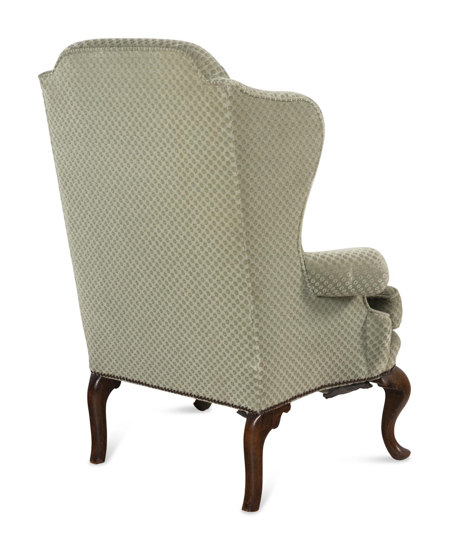 A Queen Anne Style Mahogany Wing-Back Armchair