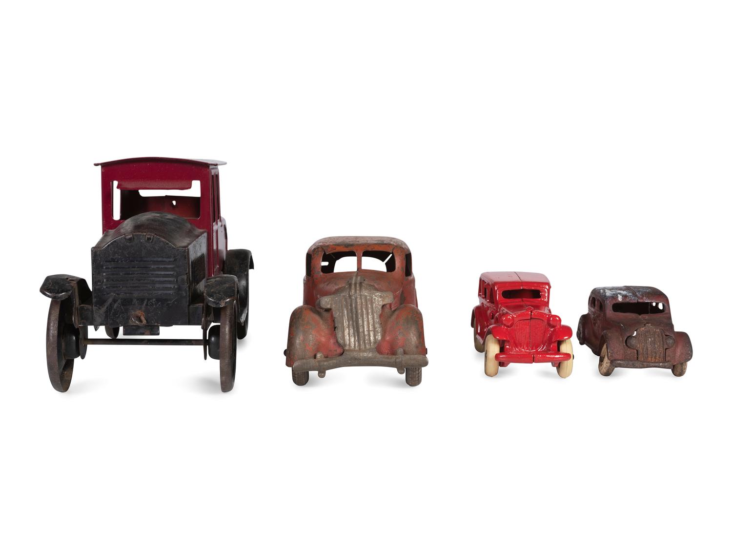 A Group of Toy Service Stations and Cars