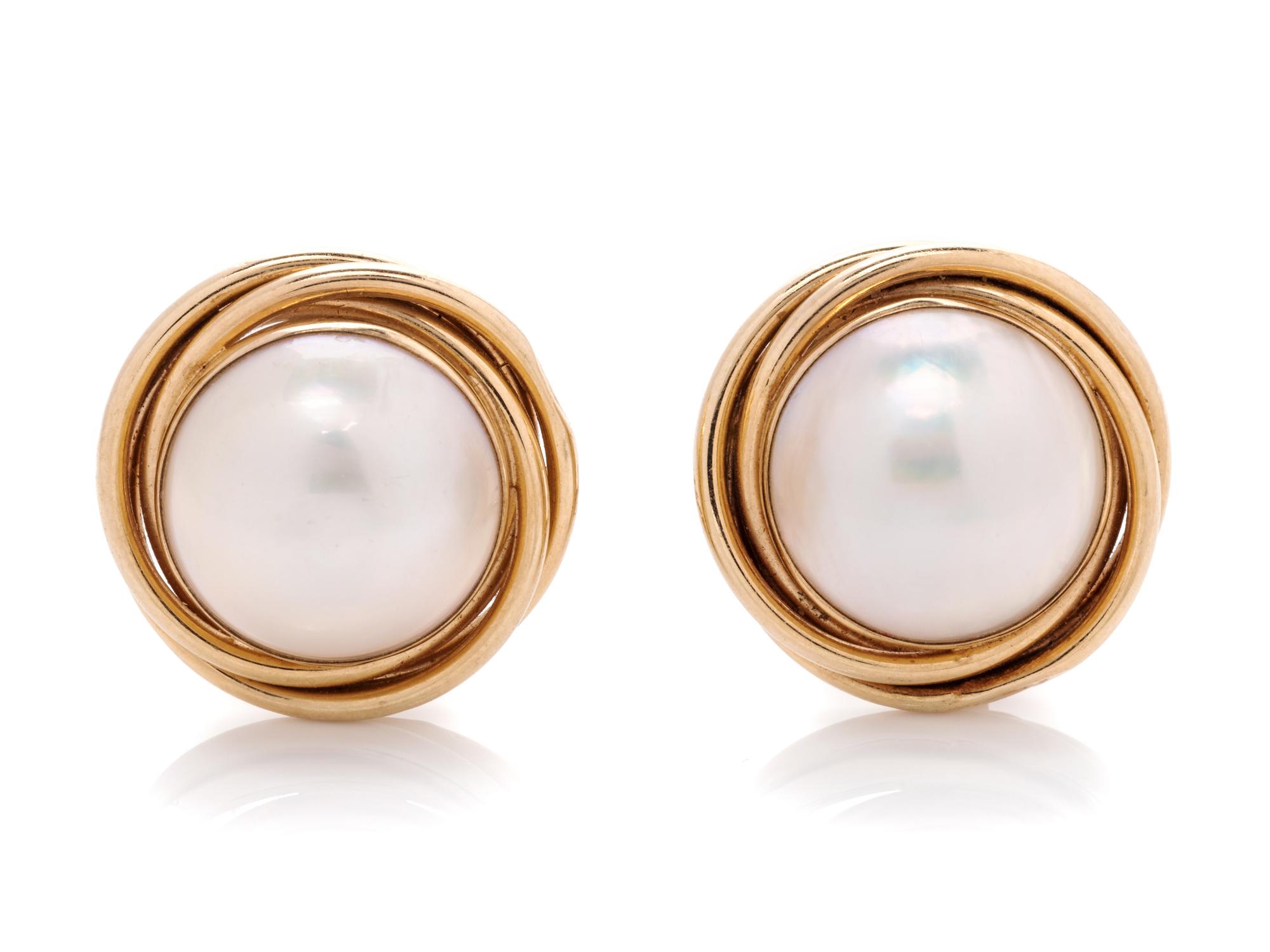 A Pair of 14 Karat Yellow Gold and Cultured Mabe Pearl Earclips,