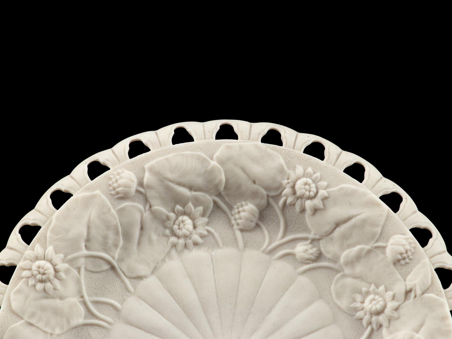 An English Pierced and Sunflower Decorated Bisque Porcelain Dessert Service