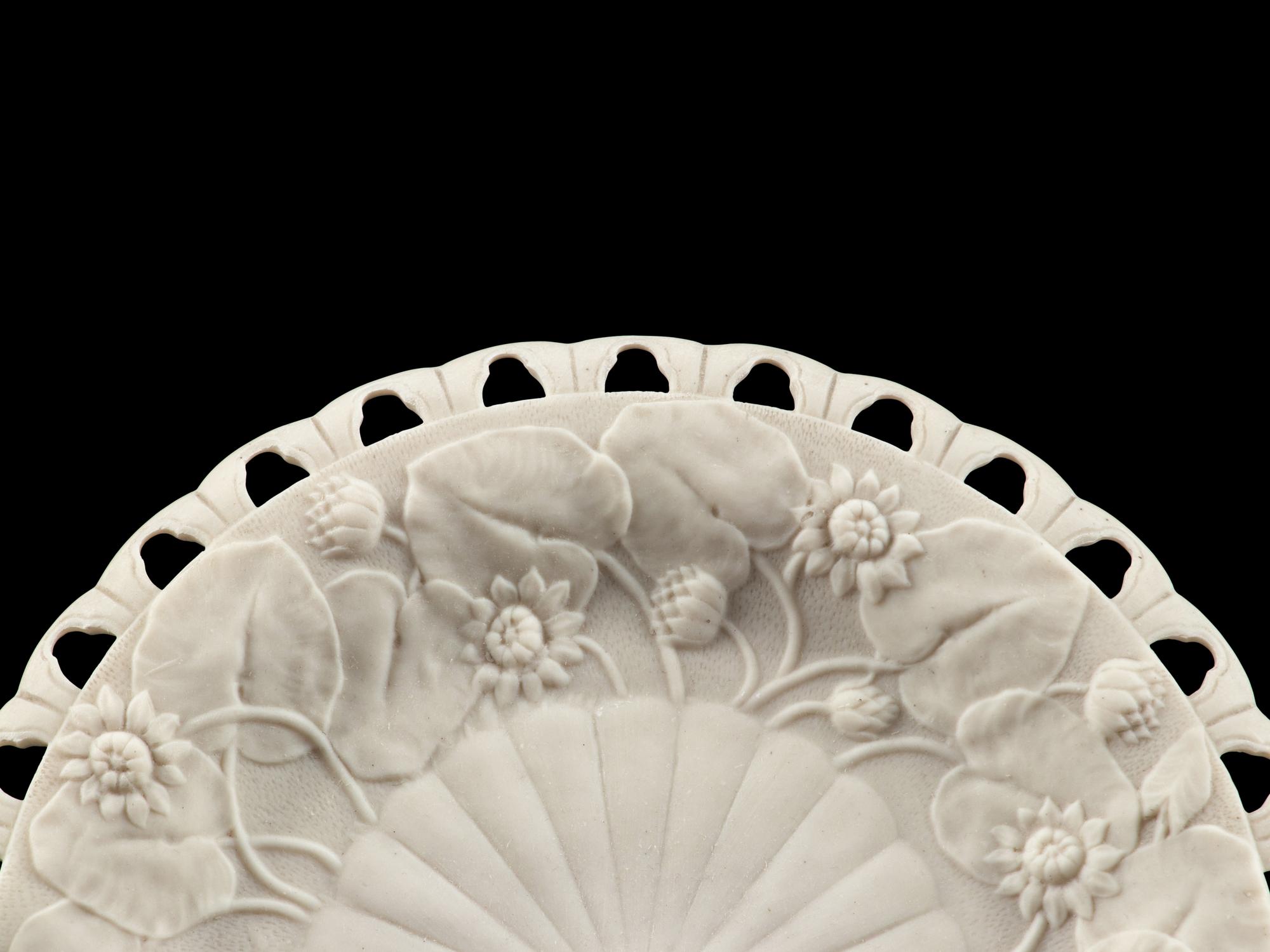 An English Pierced and Sunflower Decorated Bisque Porcelain Dessert Service