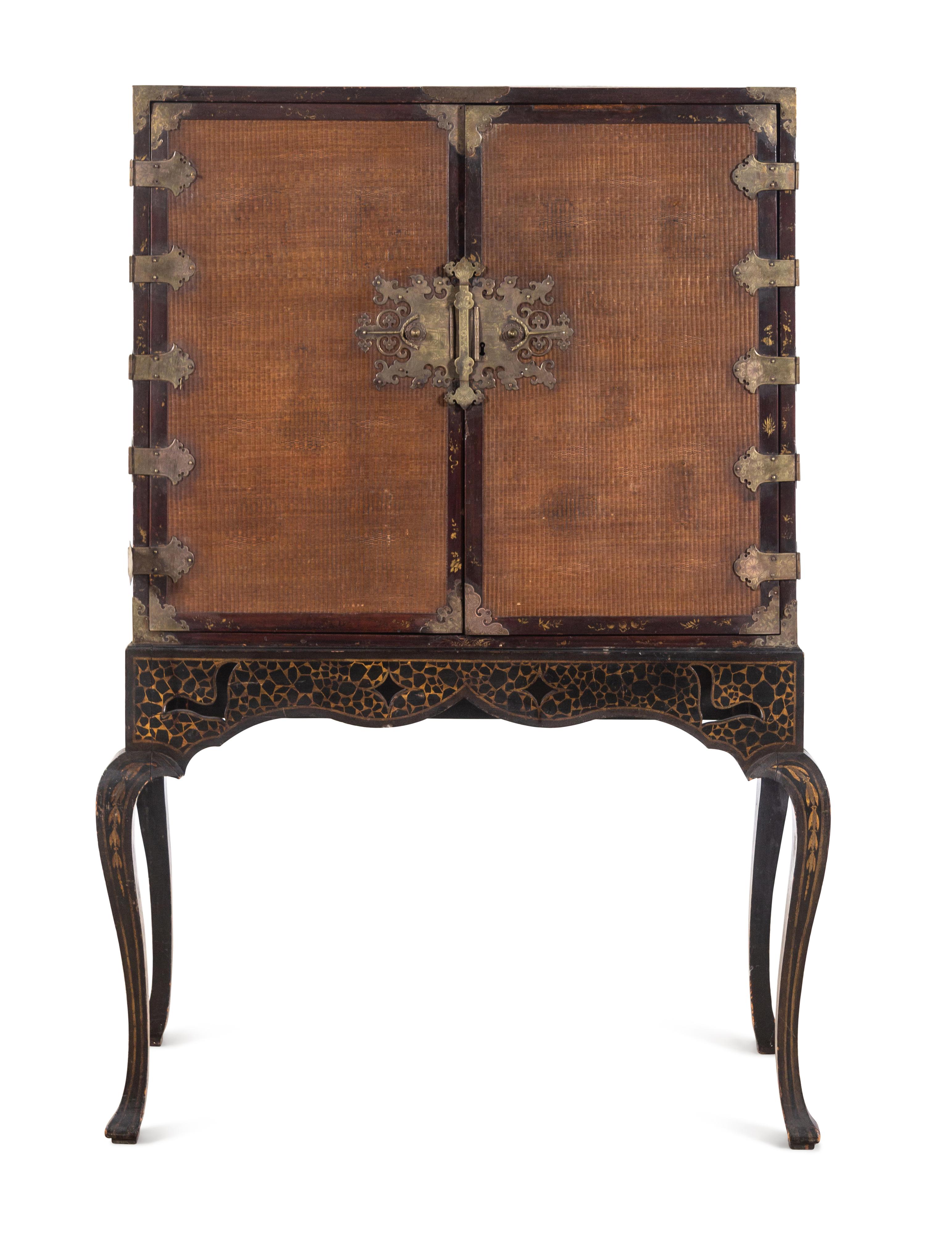 A Chinese Export Gilt Decorated Lacquer Cabinet on Stand