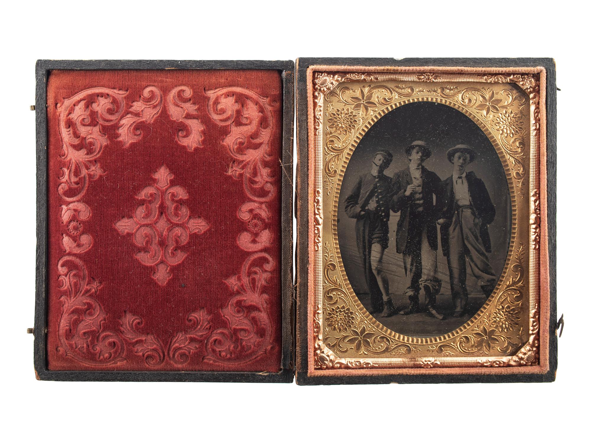 [EARLY PHOTOGRAPHY]. Quarter plate tintype of playful friends dressed in costume.