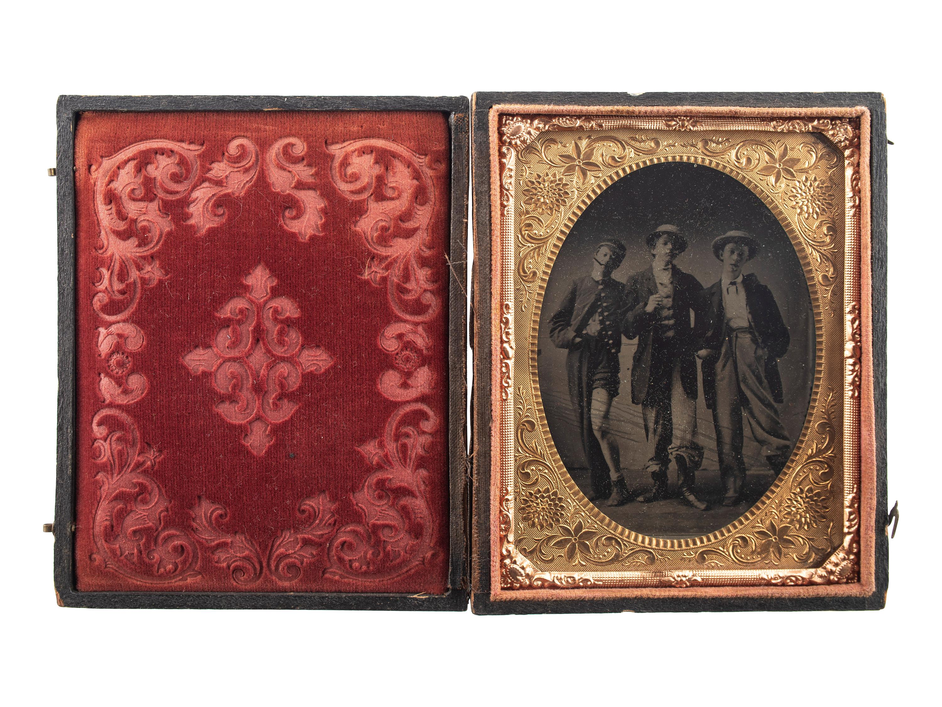 [EARLY PHOTOGRAPHY]. Quarter plate tintype of playful friends dressed in costume.