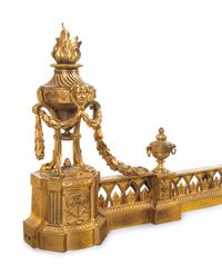 A Louis XVI Style Gilt Bronze Fire Fender with Flaming Urns