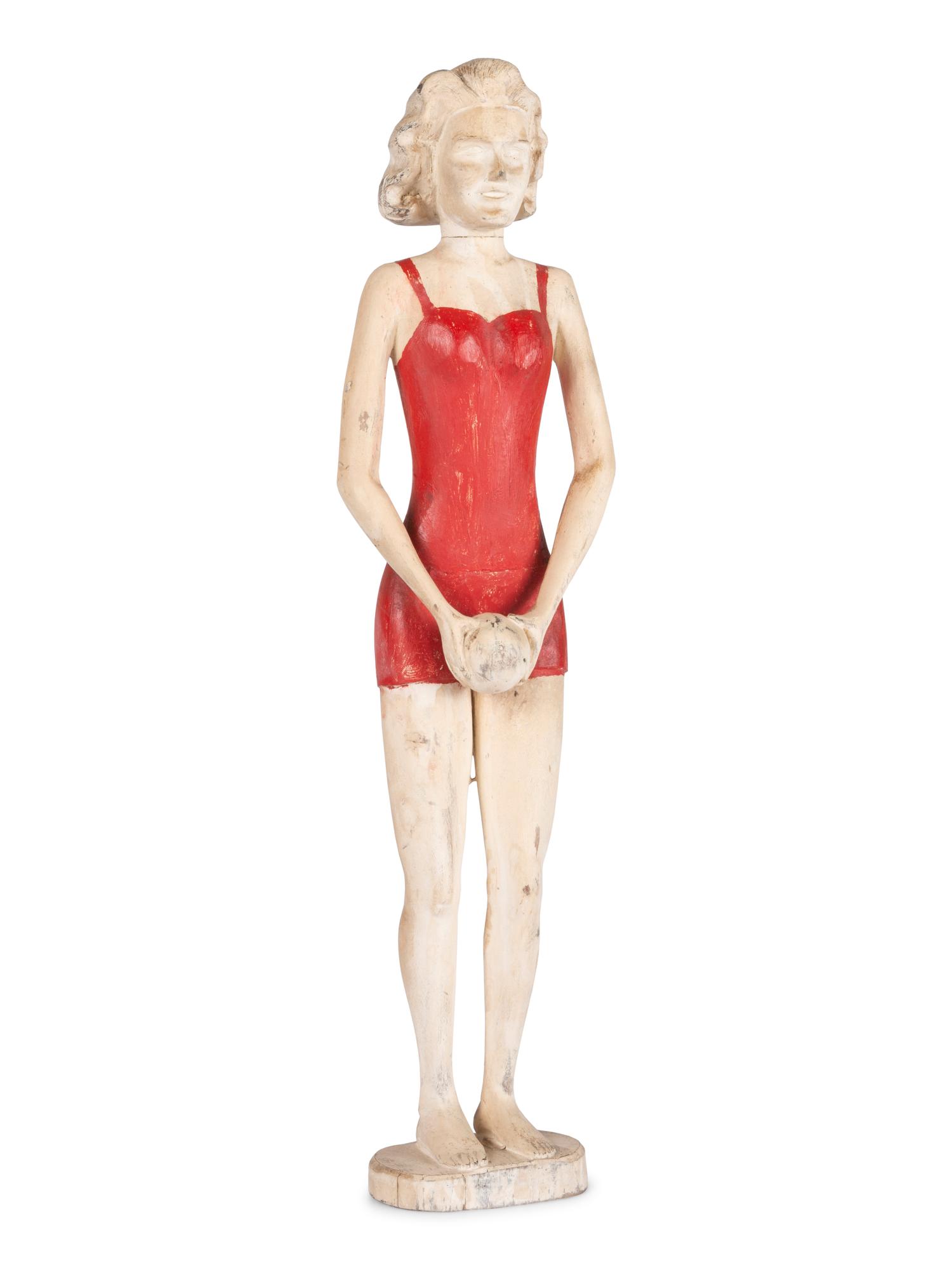 A Carved and Painted Wood Figure of a Bather