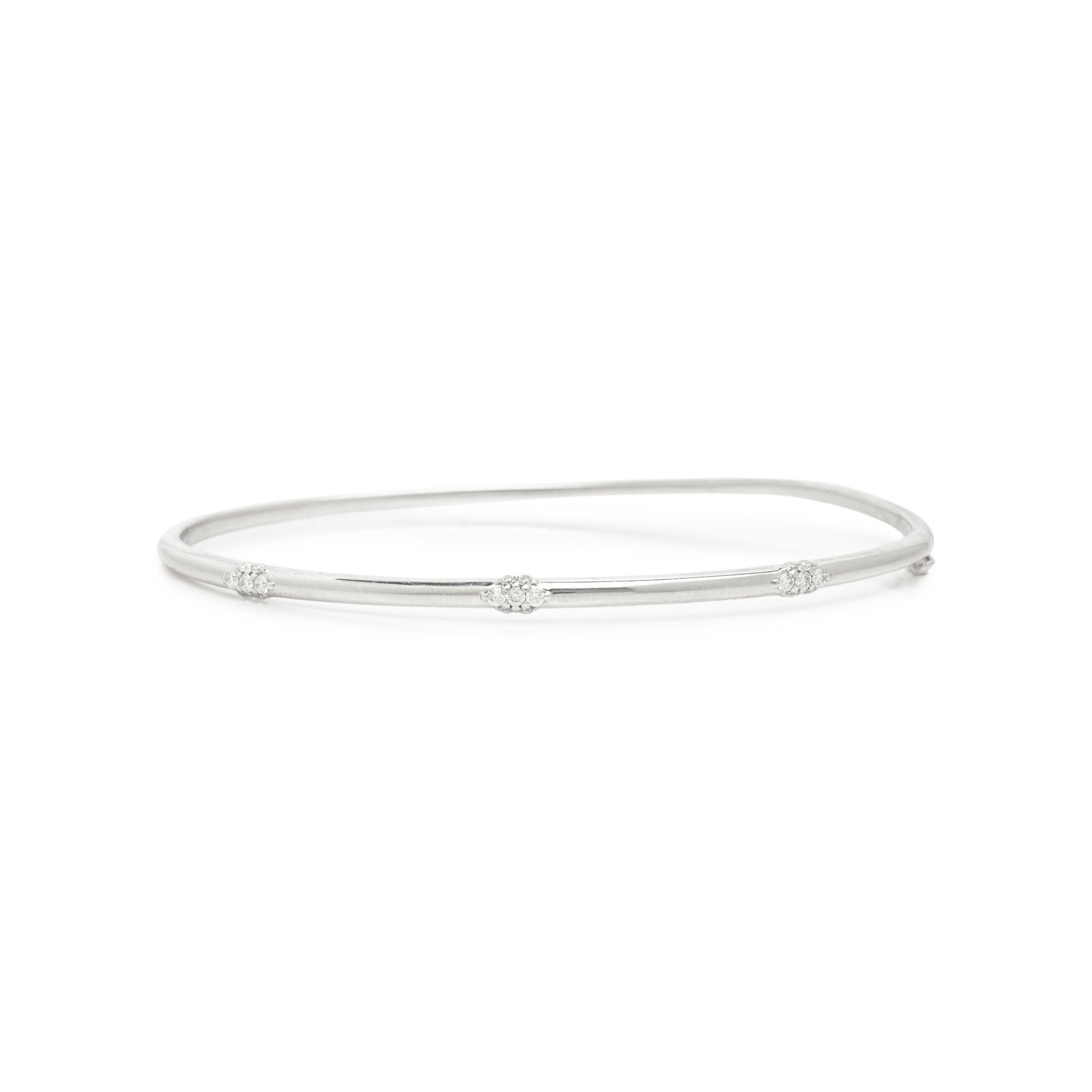 ANNA SHEFFIELD, WHITE GOLD AND DIAMOND 'CELESTINE THREE CLUSTER' BANGLE BRACELET