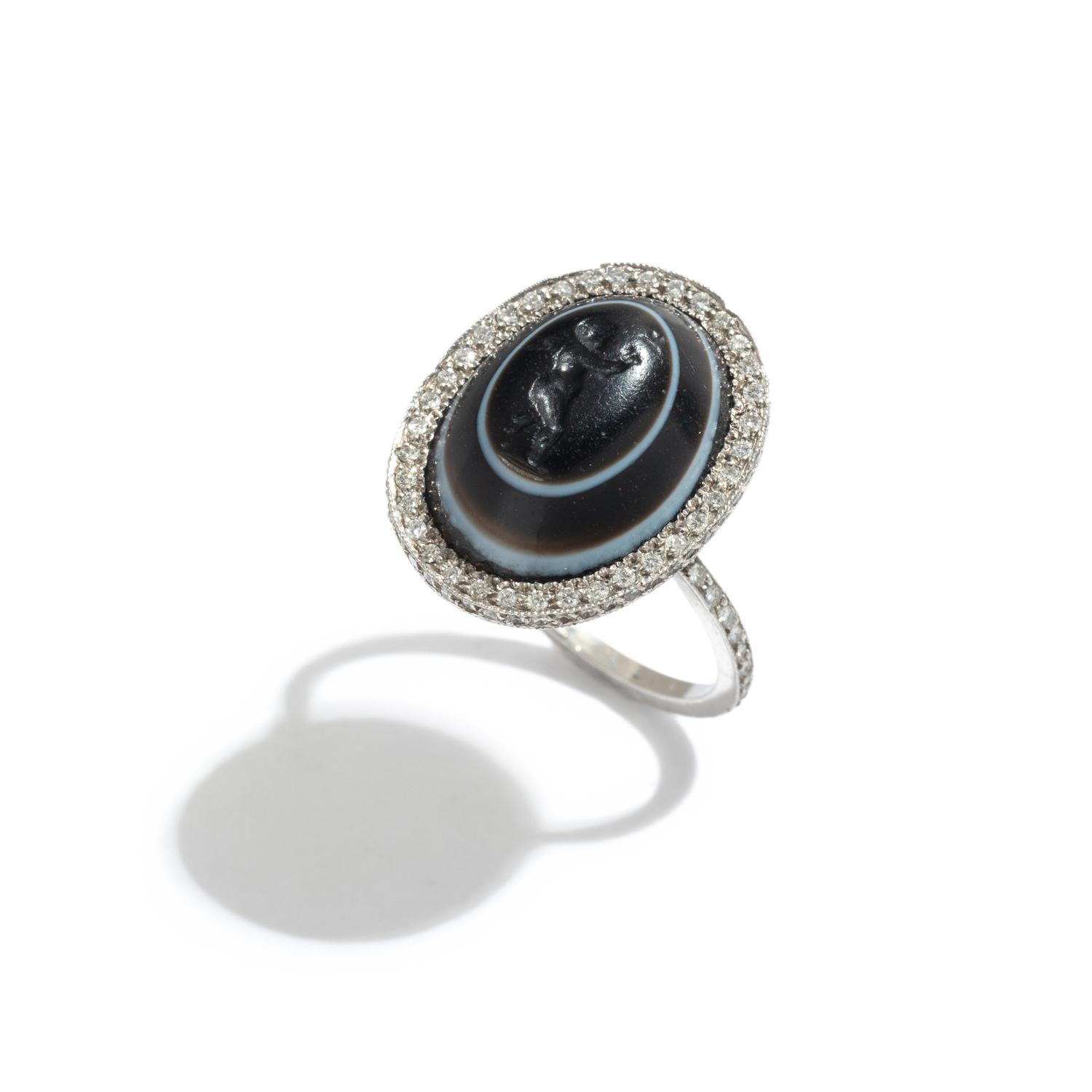 A Roman Banded Agate Ring Stone with the Infant Eros Holding a Butterfly — Set in a silver ring