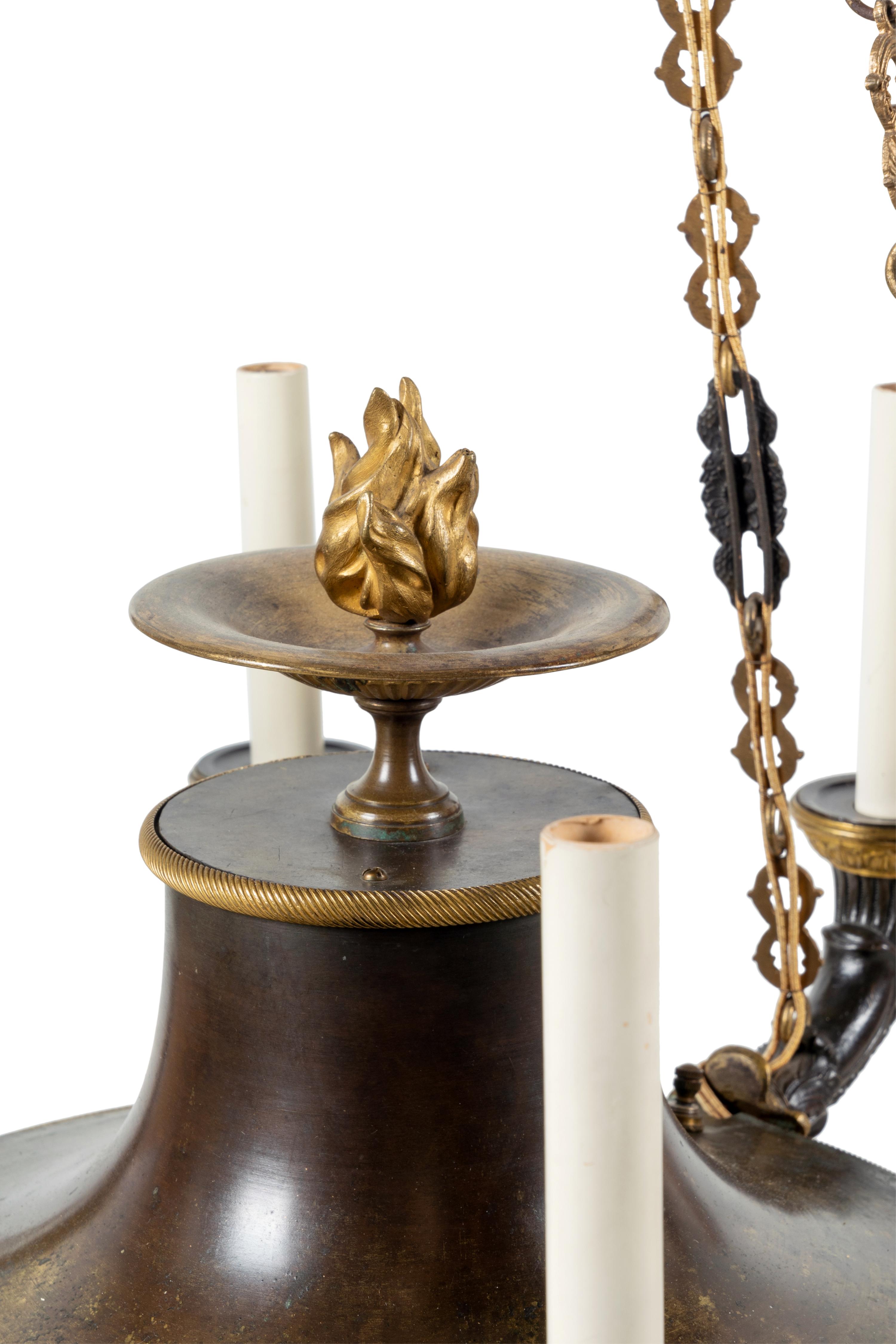 An Empire Style Gilt and Patinated Bronze Eight-Light Chandelier