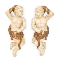 A Pair of Italian Carved, Painted and Parcel Gilt Putti