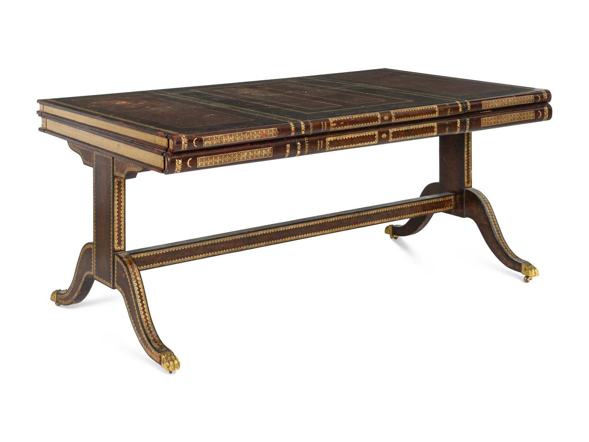 A Maitland-Smith Regency Style Gilt and Embossed Leather Veneered Desk