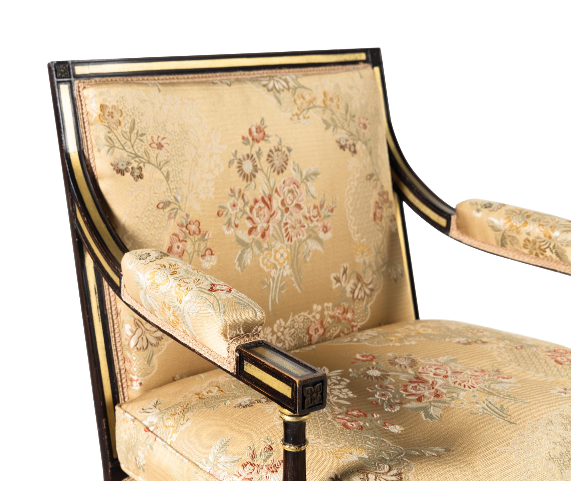 A Pair of Regency Style Painted and Parcel Gilt Armchairs