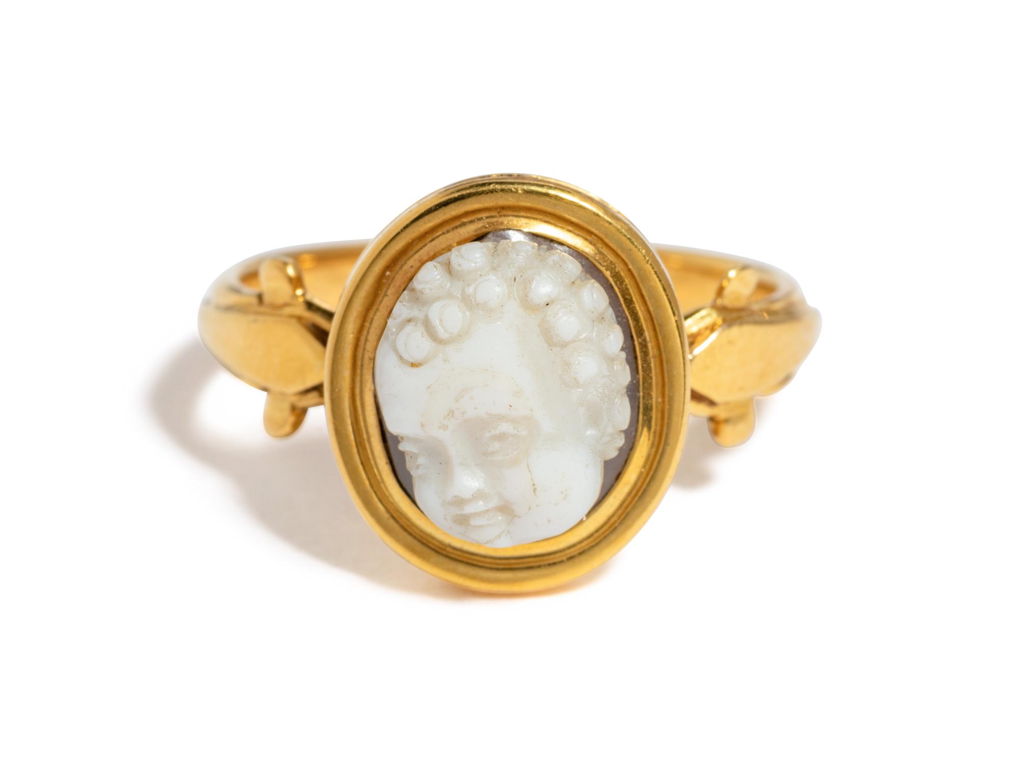 A Roman Onyx Cameo Ring Stone with the Head of a Child — Set in a gold ring