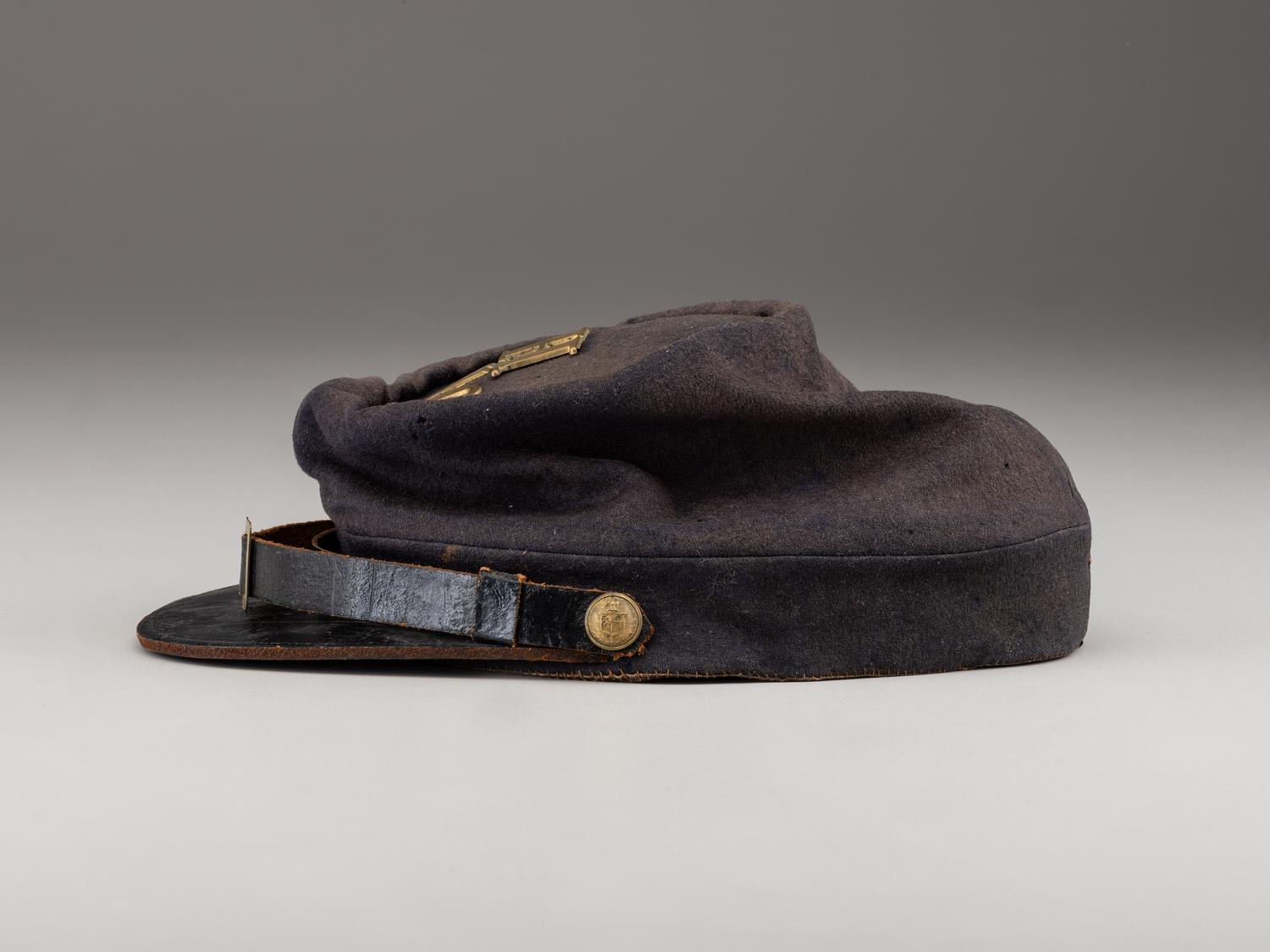 [CIVIL WAR]. A collection of items identified to brothers Robert and Samuel Burnside, Company H, 110th New York Infantry, comprised of a kepi and war-date photographs.