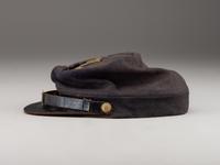 [CIVIL WAR]. A collection of items identified to brothers Robert and Samuel Burnside, Company H, 110th New York Infantry, comprised of a kepi and war-date photographs.