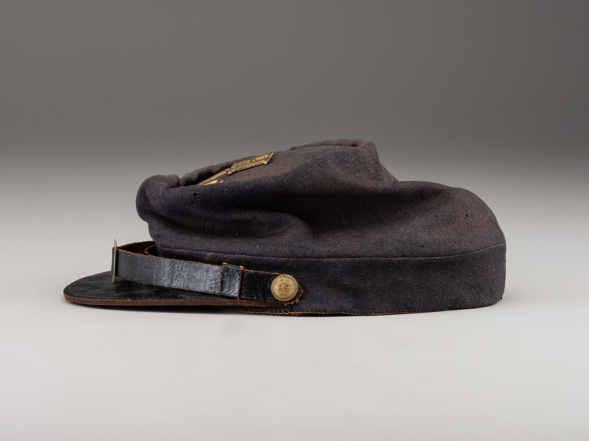 [CIVIL WAR]. A collection of items identified to brothers Robert and Samuel Burnside, Company H, 110th New York Infantry, comprised of a kepi and war-date photographs.