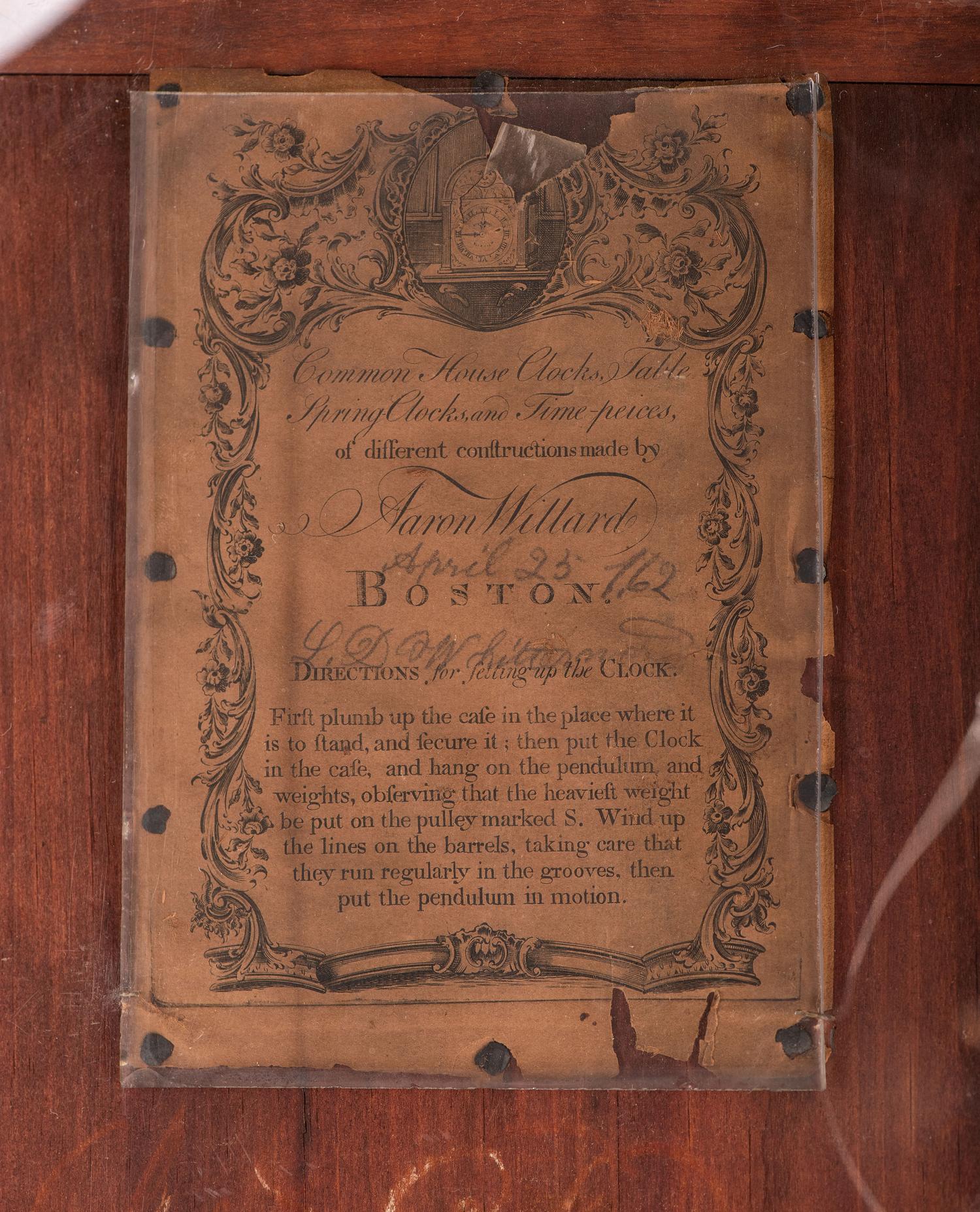 A Federal Carved, Inlaid and Figured Mahogany Tall Case Clock