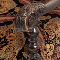 A Louis XIII Carved Walnut Fauteuil