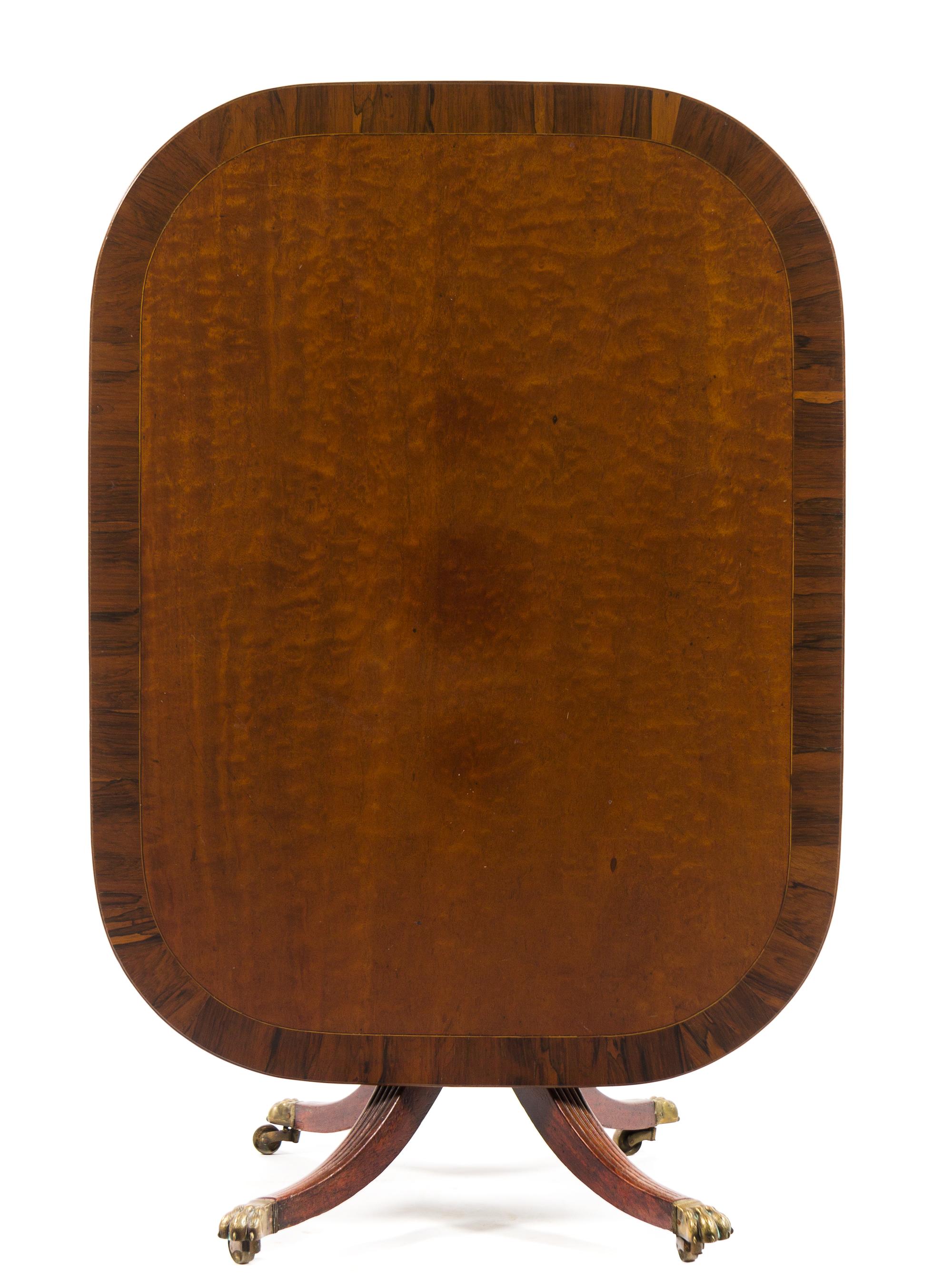 A Regency Rosewood Banded Mahogany Breakfast Table Height 27 1/2 x width 49 1/2 x depth 37 1/2 inches. — EARLY 19TH CENTURY