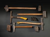 Nine Cast Iron Logging Stamps and Hammers