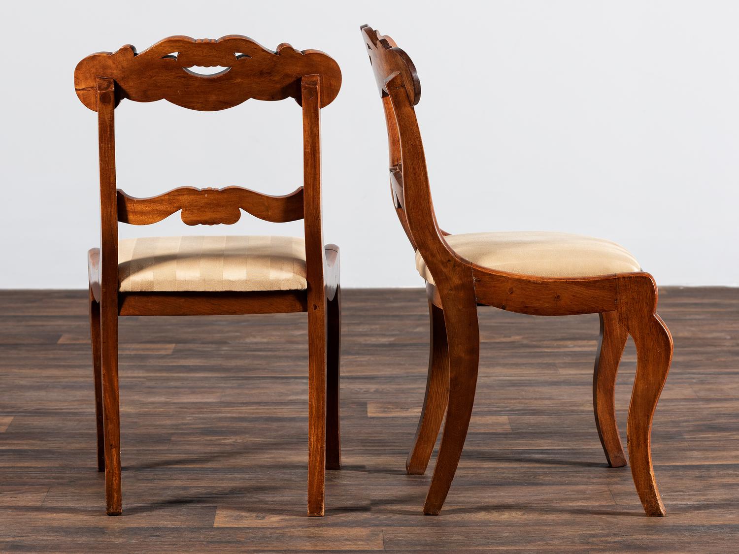 A Set of Six Classical Carved Walnut Dining Chairs