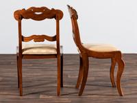 A Set of Six Classical Carved Walnut Dining Chairs