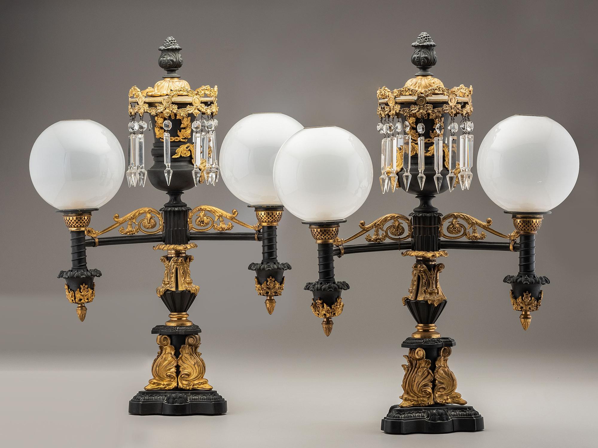 A Pair of Classical Gilt and Patinated Bronze Two-Light Argand Lamps with Shades