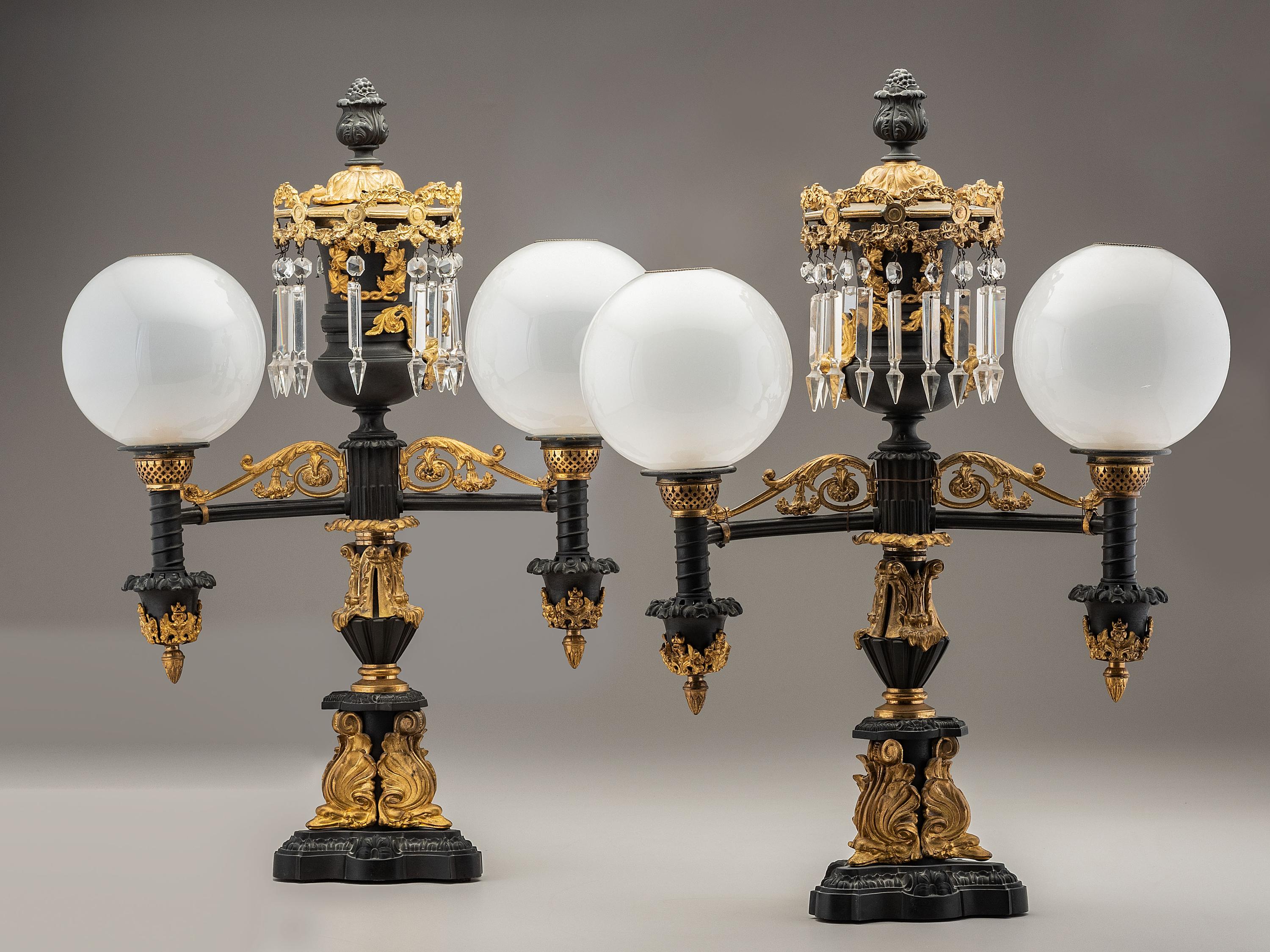 A Pair of Classical Gilt and Patinated Bronze Two-Light Argand Lamps with Shades