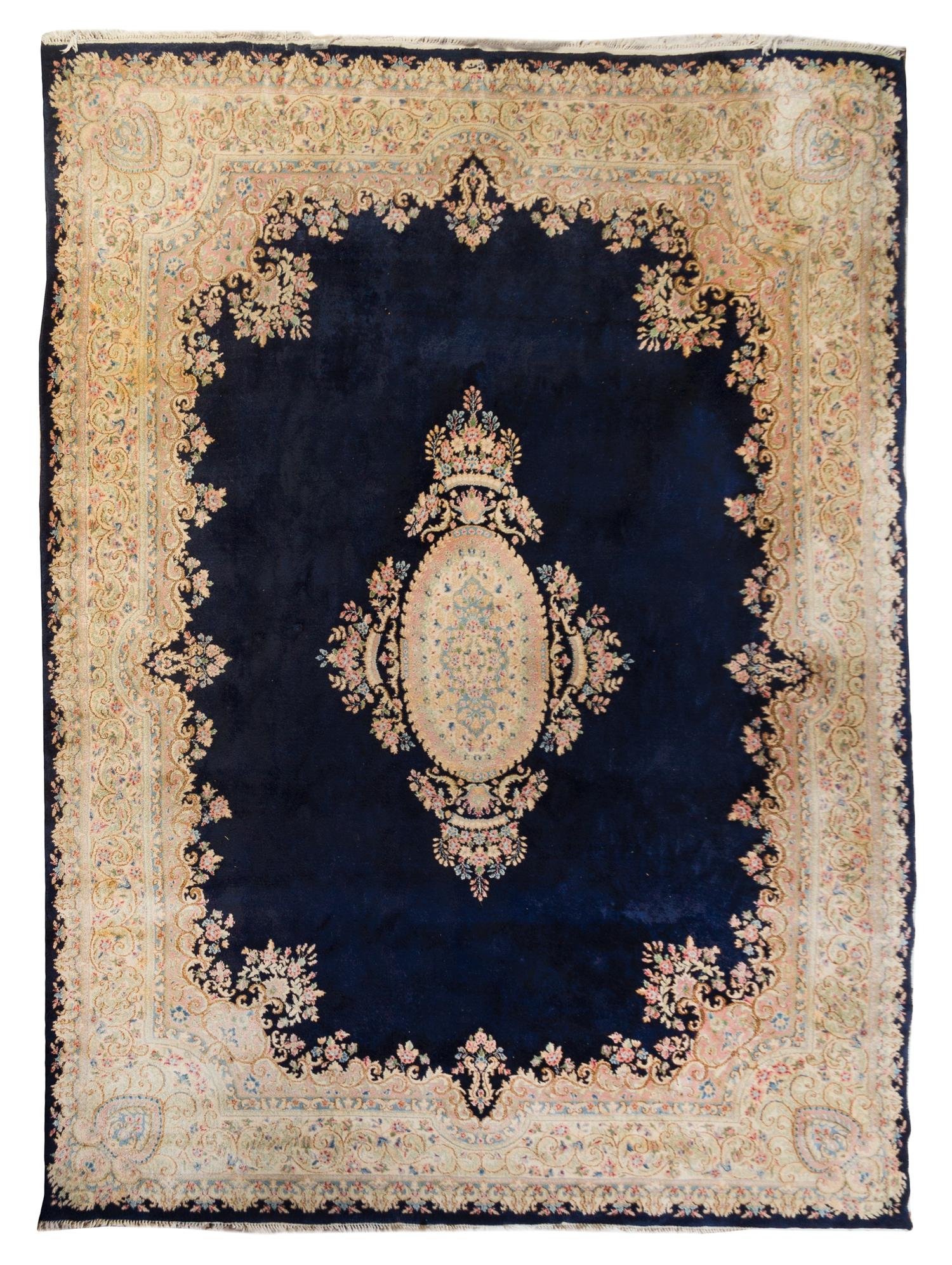 A Kirman Wool Rug 12 feet 2 inches x 9 feet. — FIRST HALF 20TH CENTURY