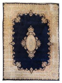 A Kirman Wool Rug 12 feet 2 inches x 9 feet. — FIRST HALF 20TH CENTURY