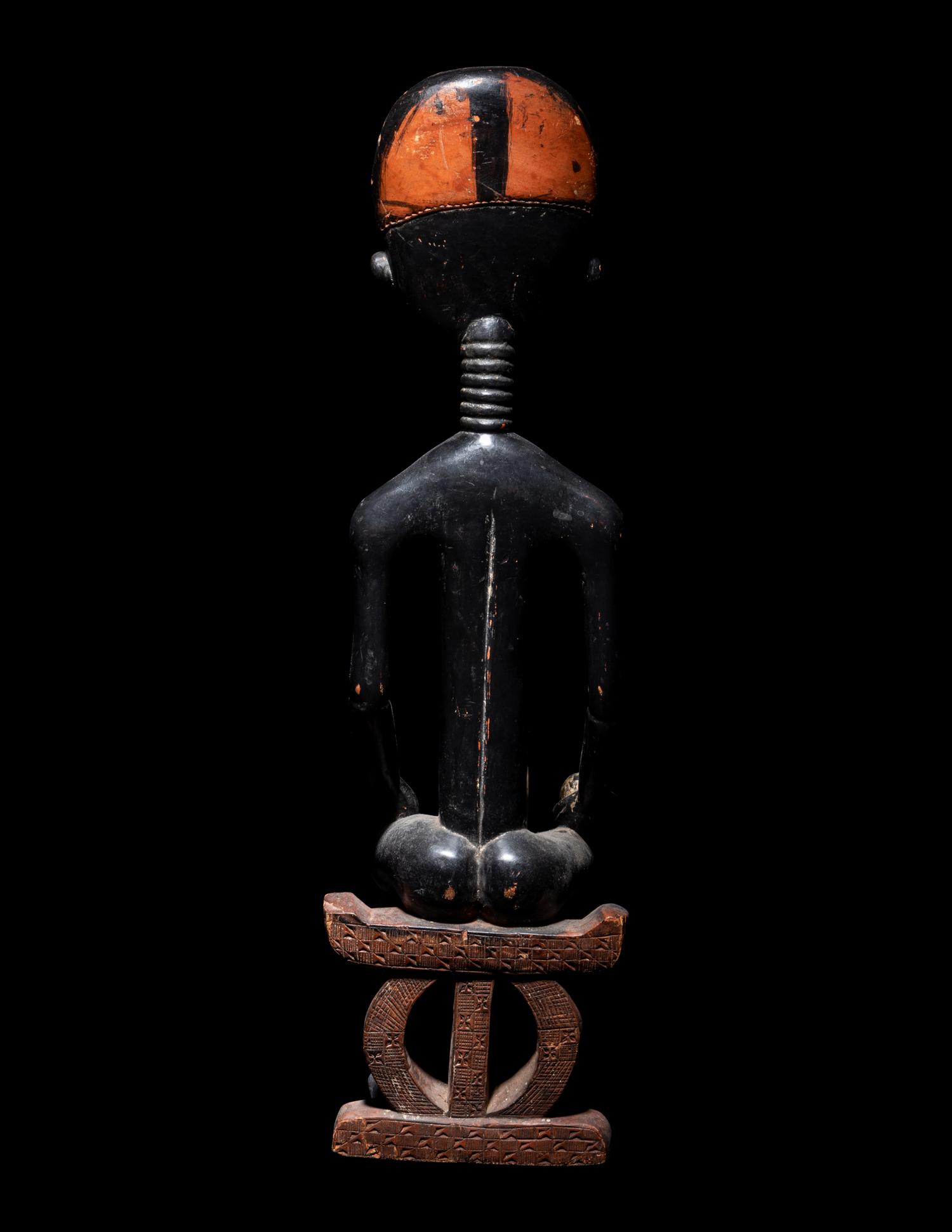 An Akan Wood Figure Seated on a Throne